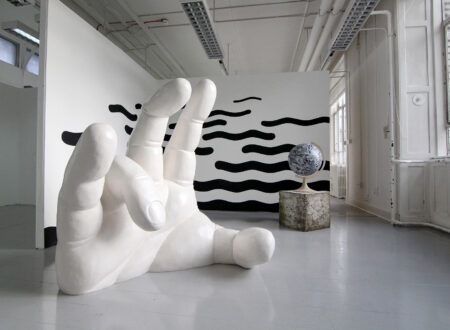 When Little Worlds Collide (2016) by Timo Aho combines sculpture, collage and mural — a hand reaching toward the summer solstice sun, a moon globe built from 19th-century lunar photographs, and black waves on the walls. A meditation on the contemporary world and its challenges.